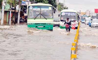 Many streets have been badly submerged under floodwaters after long-lasting heavy rains in HCMC recently (Photo: HCMC)
