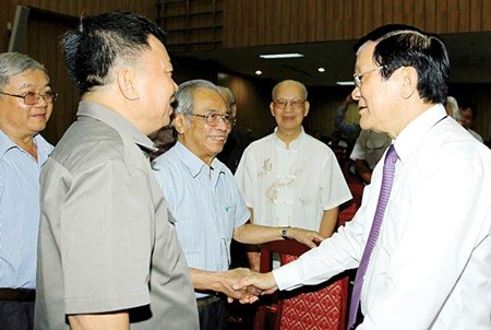 President Truong Tan Sang (R) attends a national scientific conference on the role of arts and literature in developing personalities of Viet Nam in HCM City yesterday. — Photo VNA
