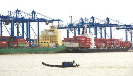 Goods are transported at Cat Lai Port in HCM City for exports. Viet Nam's economy will grow at 6 per cent in 2015, WB predicts. — VNA/VNS Photo Hoang Hai
