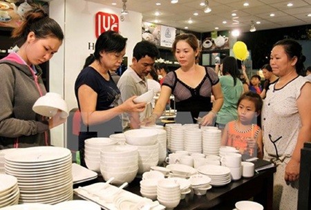 Visitors browse at a fair VNA