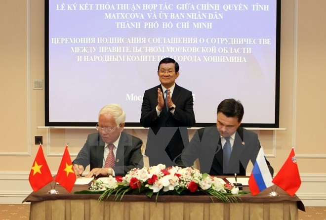 President Truong Tan Sang witnesses the cooperation agreement signing ceremony between the two cities. (Source: VNA)