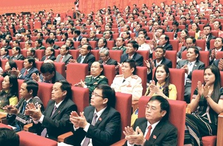 Delegates at the 12th National Party Congress, a congress of solidarity, democracy, discipline and renewal in Ha Noi yesterday. (Photo: VNA/VNS)