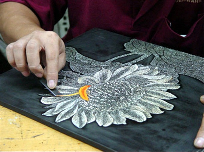 Lacguer painting requires extreme meticulousness and patience.