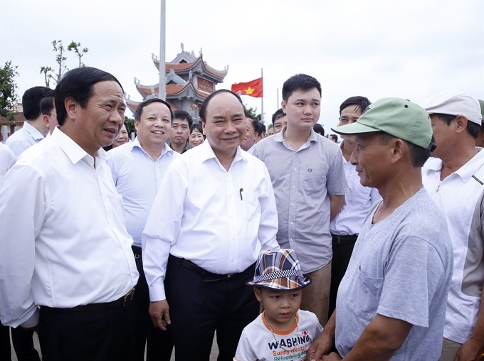 Prime Minister Nguyễn Xuân Phúc (second left) meets voters in northern Hải Phòng Province’s Tiên Lãng District yesterday. (Photo: VNA/VNS)