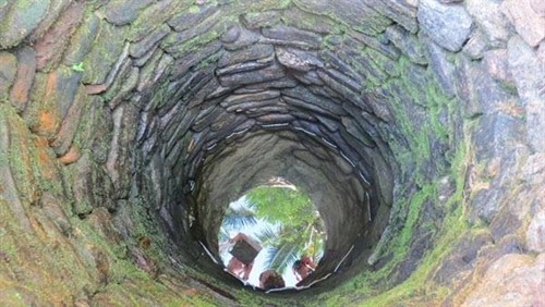 Still flowing: An old man uses water from a 200-year-old well that was tapped when the house was built. (Photo: VNS)