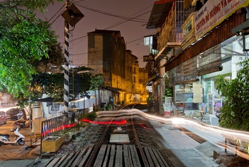 Beauty and richness: A photo taken by Sébastien Laval features Hà Nội’s railways and a shop at night.Viet Nam News