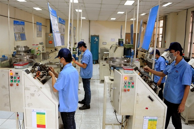 Employees of the HCM City-based Dien Quang Lamps JSC work on a compact bulb production line. Viet Nam is urged to strengthen market-based reforms and invest in education and training in order to take advantage of opportunities arising from the next digitalisation-driven production revolution. — VNA/VNS Photo An Hieu