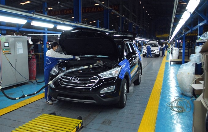 HUYNDAI Thành Công Việt Nam Factory workers assemble cars in Gián Khẩu Industrial Zone in northern Ninh Bình Province. (Photo: VNA/VNS)