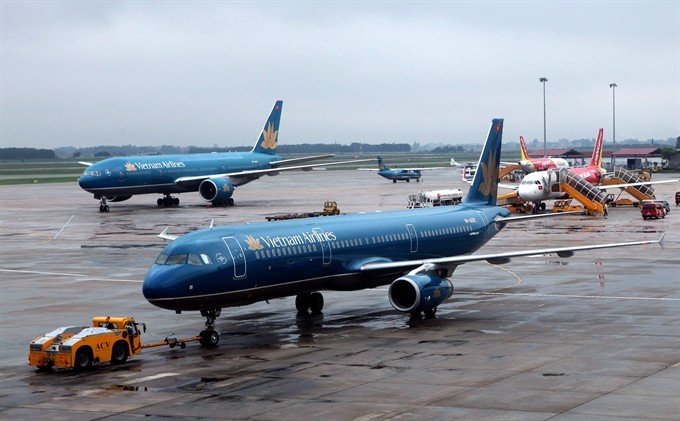 Airplanes park at Nội Bài International Airport. The Ministry of Transport plans to assist domestic airlines to broaden international routes in the ASEAN block during 2016-20. — VNA/VNS Photo Huy HùngViet Nam News