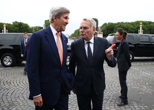 US Secretary of State John Kerry (left) flew to Moscow after attending the Bastille Day parade on the Champs Elysees in Paris, on Thursday. — AFP Photo