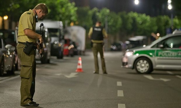 A policeman stands near the scene after a man was killed and 11 others were injured in an explosion in Franconia Ansbach. Photograph: Daniel Karmann/EPA