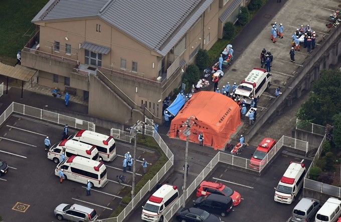 An aerial view shows emergency members at the Tsukui Yamayuri Garden, a residential care facility for disabled people in Sagamihara, Kanagawa Prefecture, about 40 km west of Tokyo, Japan on Tuesday. A man stabbed residents at the facility with a knife and killed at least 19 people and injured at least 26 in the early morning hours of Tuesday