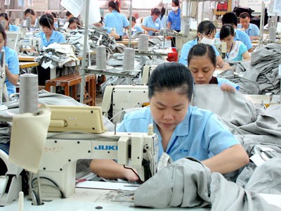 Workers at a garment plant in HCMC, where minimum wage will increase to VND3.75 million next year (Photo: SGGP)