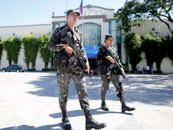 Philippine police patrol Las Pinas city, southern Manila. (Photo: EPA/TTXVN)