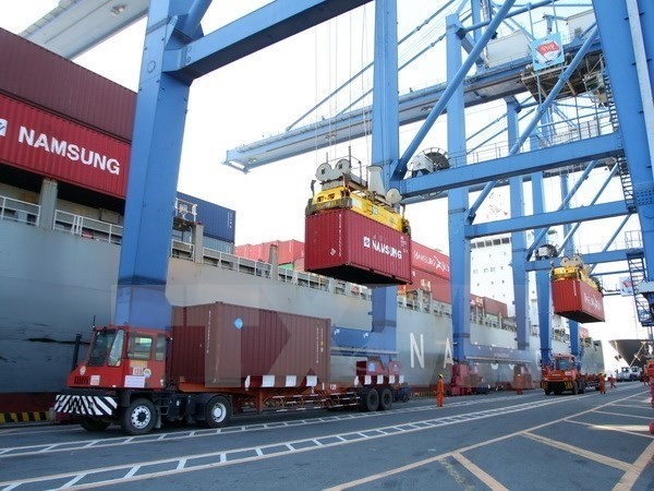 Containers are being unloaded at Cat Lai port in HCM City. (Source: VNA)