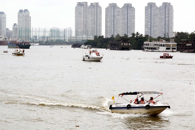 Waterway police patrol the Bach Dang Wharf in District 1, HCM City. – VNA/VNS Photo Hoàng Hải
