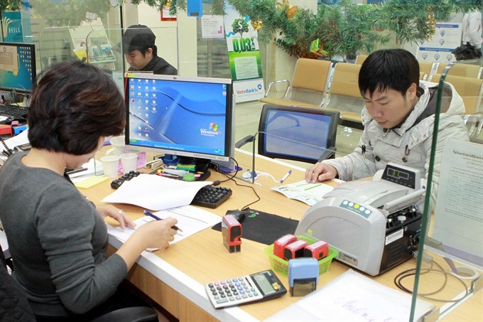 A Vietinbank transaction counter. The action programme specifies tasks to reform the national financial markets with a focus on credit institutions. (Photo: VNA/VNS)