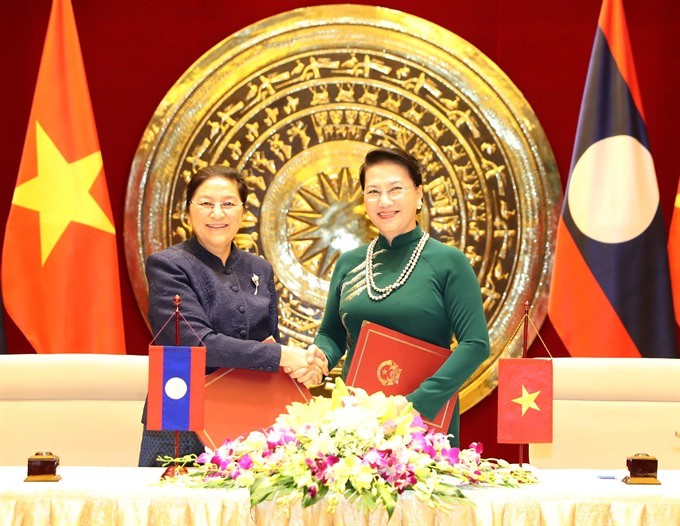 Vietnamese National Assembly Chairwoman Nguyen Thi Kim Ngan (right) and her visiting Lao counterpart Pany Yathotou signed an agreement yesterday to enhance co-ordination between the two parliaments. (Photo: VNA/VNS)