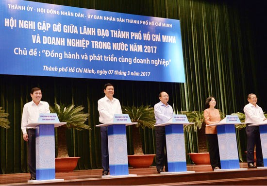 HCMC's top leaders at meeting with over 400 businesses on March 7 (Photo: SGGP)