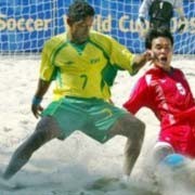 Brazil's Nenem (L) and Thailand's Kay vie for the ball during their 2005 FIFA Beach Soccer World Cup match