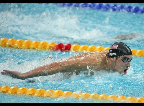 Michael Phelp, US takes a stroke in the men's 400m relay swimming event