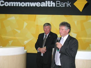 Commonwealth Bank's Garry Mackrell (R) speaks at the branch opening ceremony while Australian Consul General Mal Skelly looks on (Photo: Tuong Thuy)