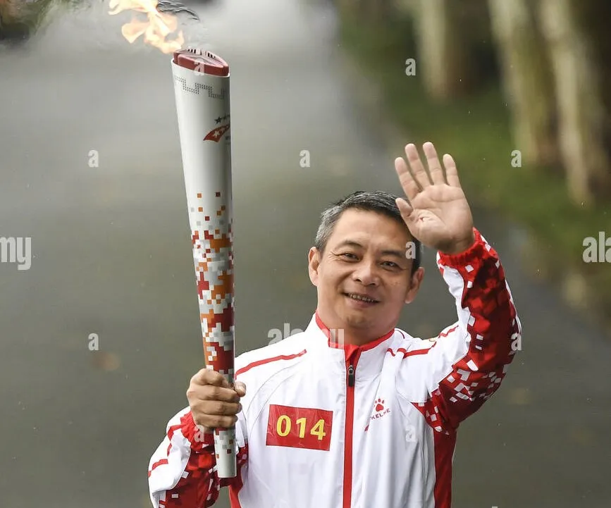 wuhan-chinas-hubei-province-16th-oct-2019-torchbearer-li-xiaoshuang-participates-in-the-7th-international-military-sports-council-cism-military-world-games-torch-relay-in-wuhan-capital-of-central-chinas-hubei-provi.jpg