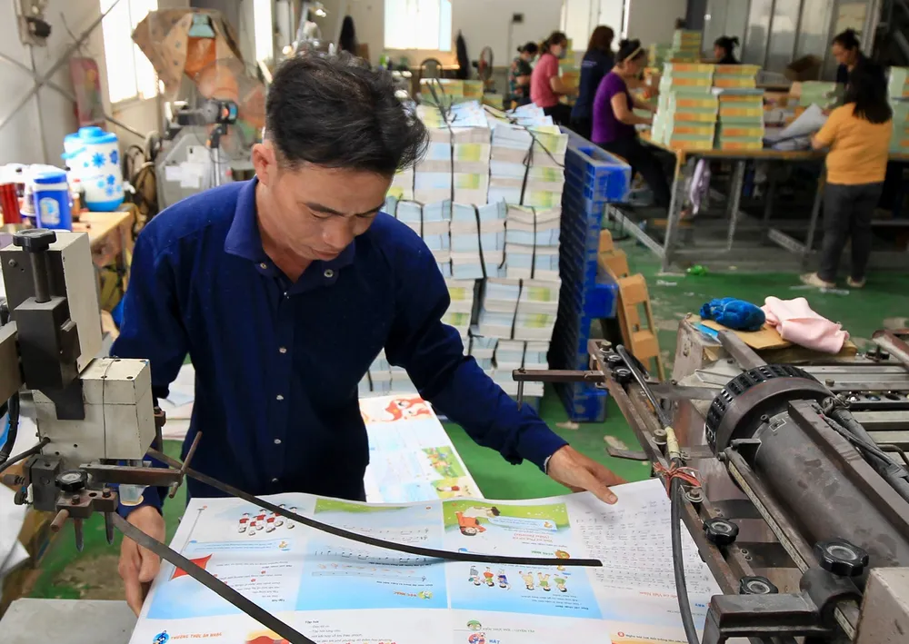 Hoạt động in ấn tại Công ty TNHH MTV In Sài Gòn Giải Phóng. Ảnh: DŨNG PHƯƠNG