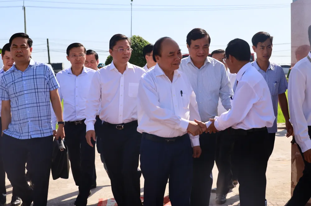 Chủ tịch nước Nguyễn Xuân Phúc thăm và tặng quà cho các gia đình thương binh, liệt sĩ ở Quảng Nam ảnh 3