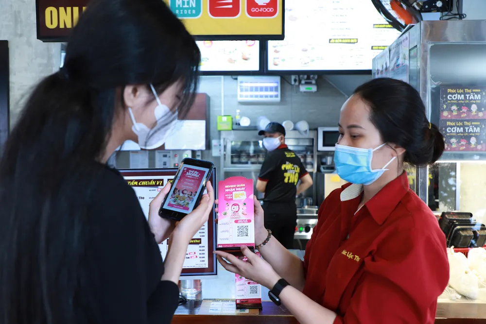 MoMo và iPOS.vn hợp tác chiến lược phục vụ cộng đồng doanh nghiệp F&B Việt Nam ảnh 1