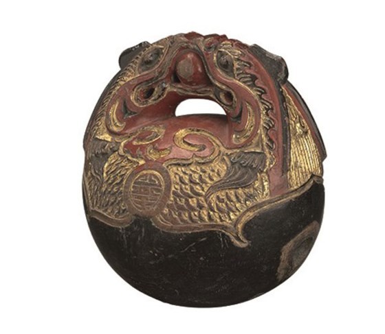 A wooden bell in the collection