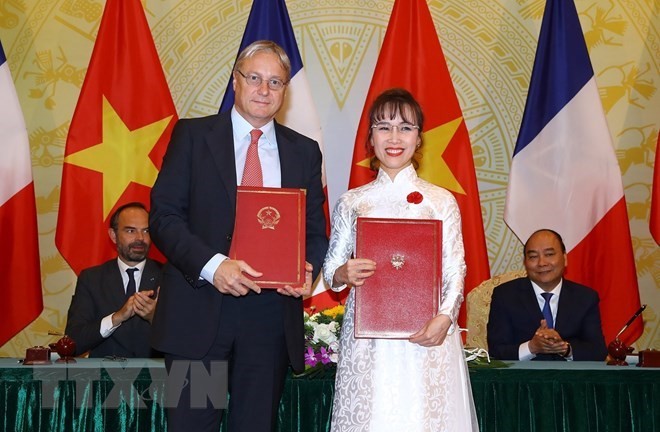 At the signing ceremony (Source: VNA)