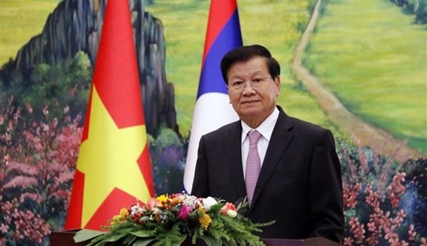 Lao leader calls on Lao, Vietnamese people to nurture special relationship ảnh 1