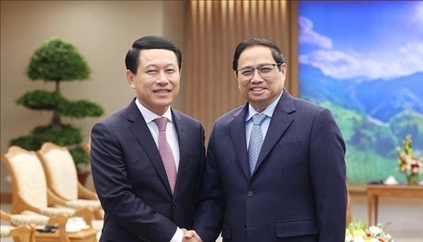 PM Pham Minh Chinh receives Lao Deputy PM, Foreign Minister ảnh 1