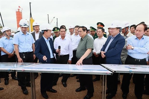 PM Pham Minh Chinh (front, third from right) inspects the construction of terminals at Hai Phong International Gateway Port on May 13. (Photo: VNA) PM Pham Minh Chinh (front, third from right) inspects the construction of terminals at Hai Phong International Gateway Port on May 13. (Photo: VNA)
