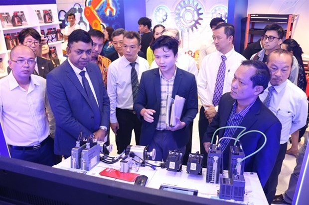 Visitors at a mechanical and electrical devices and digital technology fair opens in HCM City on June 1. (Photo courtesy of HCMC Investment and Trade Promotion Center)