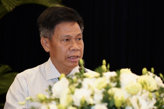 Mr. Tran Lam Hong, general director of the HCMC Union of Trading Cooperatives delivers his speech at the forum. (Photo: SGGP)