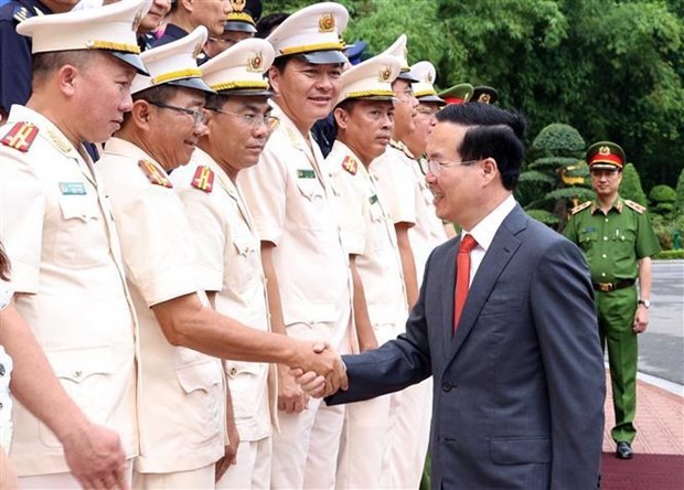 President Vo Van Thuong greets participants in the meeting in Hanoi on June 14. (Photo: VNA)