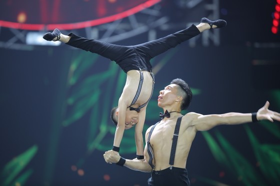 Meritorious Artist Quoc Nghiep and his son