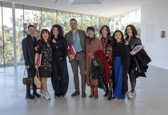 Artist, designer Tia-Thuy Nguyen (3rd, L)