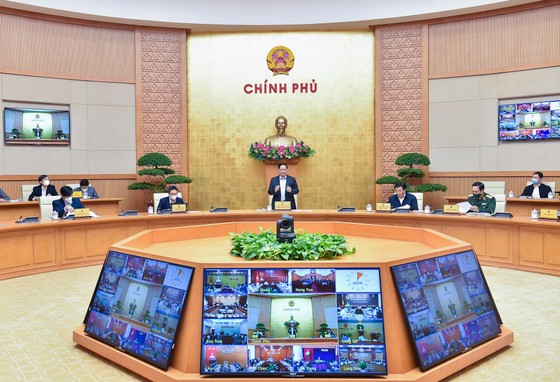 Thủ tướng Phạm Minh Chính chủ trì họp Chính phủ về phòng chống dịch. ẢNH: VIẾT CHUNG