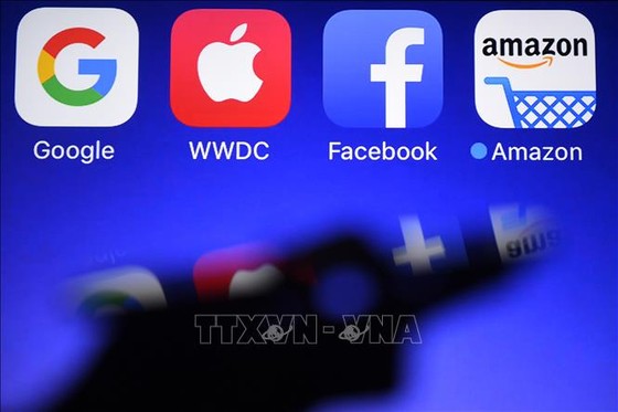 Biểu tượng của Amazon, Apple, Google và Facebook . Ảnh: AFP/TTXVN