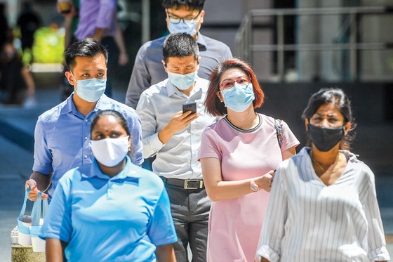 Người dân Singapore hướng đến sẽ xem Covid-19 như là bệnh cúm.