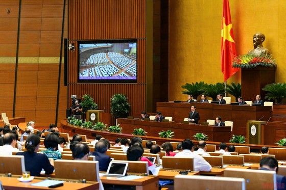 Bộ trưởng Giao thông vận tải Nguyễn Văn Thể trả lời chất vấn của đại biểu Quốc hội chiều 9/6. (Ảnh: KHOA NGUYÊN) ảnh 1 Yêu cầu xử lý dứt điểm vướng mắc tại các dự án BOT ngay trong năm 2022 -0