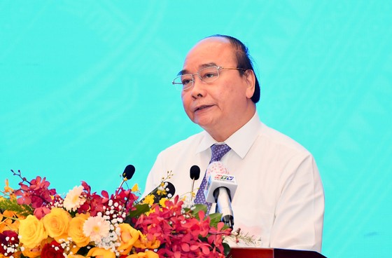 Chủ tịch nước Nguyễn Xuân Phúc phát biểu tại Hội thảo. Ảnh: VIỆT DŨNG