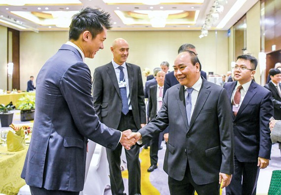 Prime Minister Nguyen Xuan Phuc welcomed business delegations at VBS 2018. Photo: VIET CHUNG