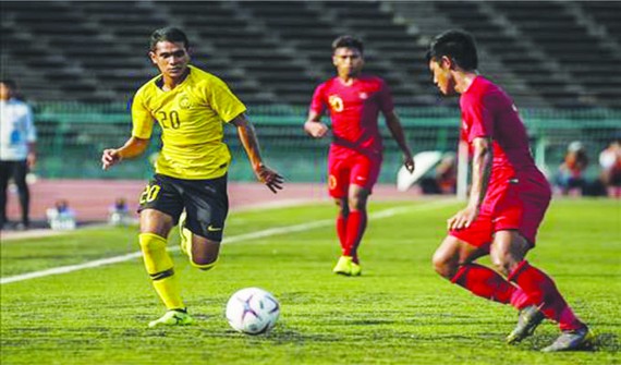 馬來西亞隊（黃衣）與緬甸隊比賽一瞥。