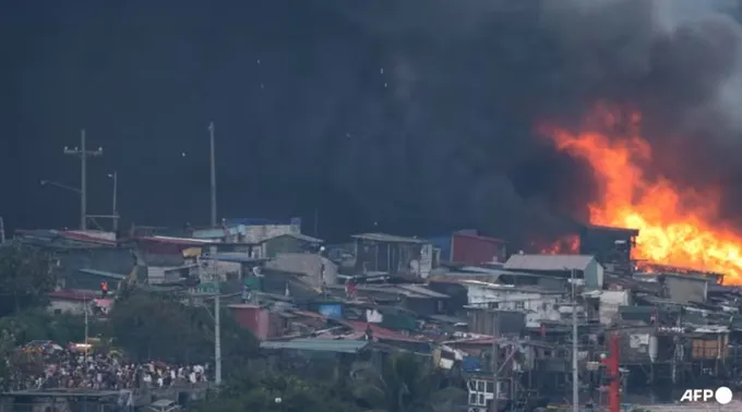 Vụ hỏa hoạn tại Isla Puting Bato. Ảnh: AFP manila-241124-5.jpg