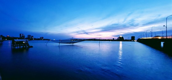 Nhat Le riverbanks glow after embellishment ảnh 2