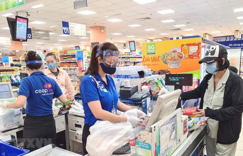 Nhu cầu nguồn nhân lực ở lĩnh vực thương mại gia tăng trong mùa dịch COVID-19. (Ảnh: Thanh Vũ/TTXVN)